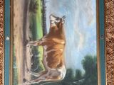 a painting of a bull that is hanging on the wall