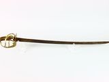 a sword that is sitting on a white surface