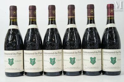 six bottles of wine are lined up on a white surface