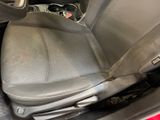 a seat in the back of a car with a cup holder in it