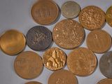 a lot of coins that are on the table