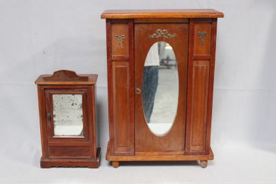 a small wooden cabinet with a mirror on top of it