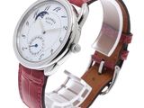 a wrist watch with a white dial on a red leather strap