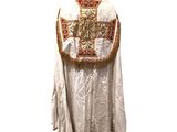 an image of a white robe with a gold cross on it