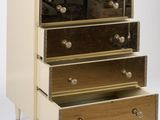 an image of a chest of drawers with mirrored drawers