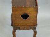 an image of a small wooden table with a drawer on it