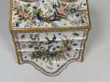 an ornately decorated box with flowers and birds on it