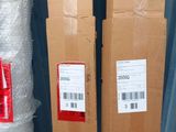 boxes are stacked on top of each other in a warehouse
