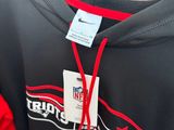 a black and red hoodie with a name tag on it