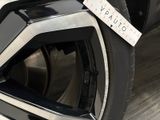 a close up of a car tire with a sticker on it