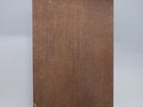 an old wooden easel with a piece of wood on top of it