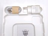 a white tray with a charger and a charger attached to it