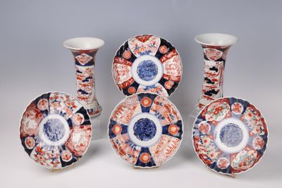 several different types of decorative vases and plates on a white surface