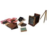 a lot of old cameras that are sitting on the ground