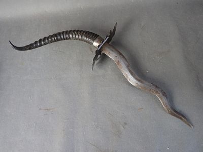 an image of a knife that is laying on a table