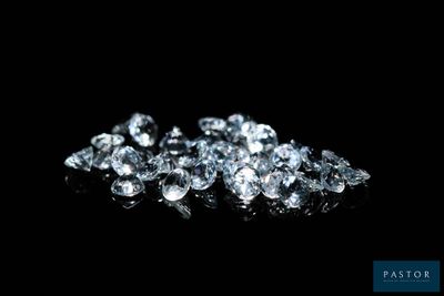 a pile of diamonds on a black background