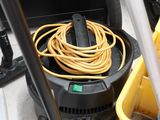 a yellow bucket with a yellow hose and a yellow bucket with a yellow hose
