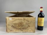 a wooden box with a bottle of wine next to it