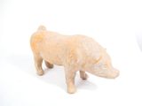a small figurine of a rhino on a white surface