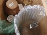 a box that has some bottles and a bag in it