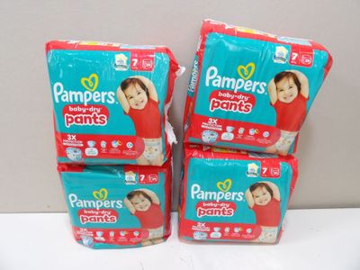 three packs of baby diapers sitting on top of each other