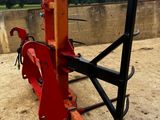 an image of a red machine that is sitting on the ground