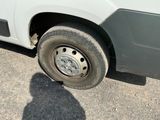 a white van that has a flat tire on it