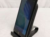a cell phone that is sitting on top of a stand