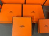 a group of orange boxes sitting on top of a table