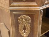 a wooden cabinet that has a drawer on top of it