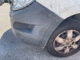 a close up of a car that has a dent in it
