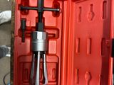 a red box with tools in it on a table