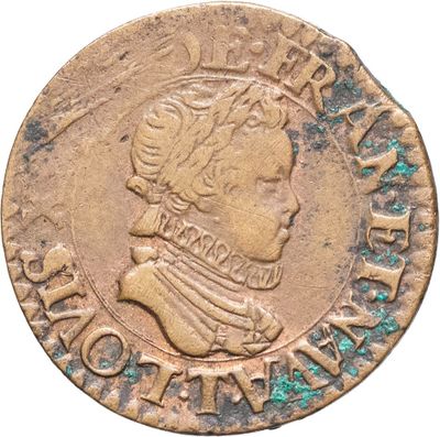 gros plan d'une pièce de monnaie sur laquelle figure une tête d'homme