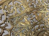 a gold plate with a clock on it on a table