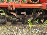 a red train car that is sitting on the tracks