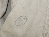 a close up of a piece of clothing with a smiley face on it