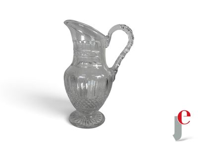 a glass pitcher with a handle on a white background