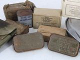 some old military items are sitting on a white surface