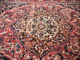 an image of a large oriental rug on a wooden floor