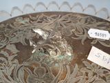 a silver plate with a floral design on it