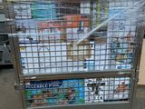 a metal cart with magazines stacked on top of it