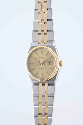 an image of a lady ' s rolex watch with two tone bracelets