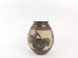 a brown vase with a picture of a man riding a horse