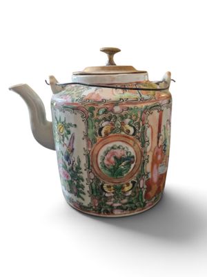 a tea pot with a lid on a white background