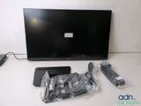 a flat screen tv sitting on a table next to other electronics