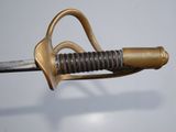 a close up of a sword with a metal handle