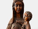 an image of a statue of a woman holding a child