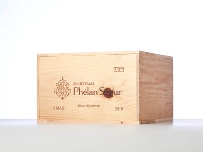 a wooden box with a label on it sitting on a table