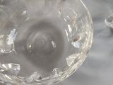 two empty glasses sitting on a table with a white table cloth