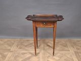 an old wooden table with a drawer on top of it on a parquet floor